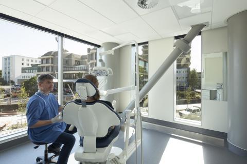 Doctor and patient in light filled treatment room in new Christchurch Hospital Outpatients Building